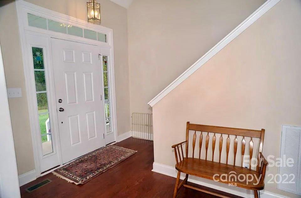 220 Sloan Road Salisbury, NC 28147 - Photo 5 of 30 a view of a hallway with wooden floor and a bathroom