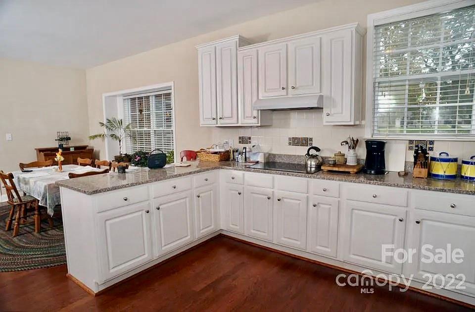 220 Sloan Road Salisbury, NC 28147 - Photo 8 of 30 a kitchen with stainless steel appliances granite countertop a sink a stove and cabinets