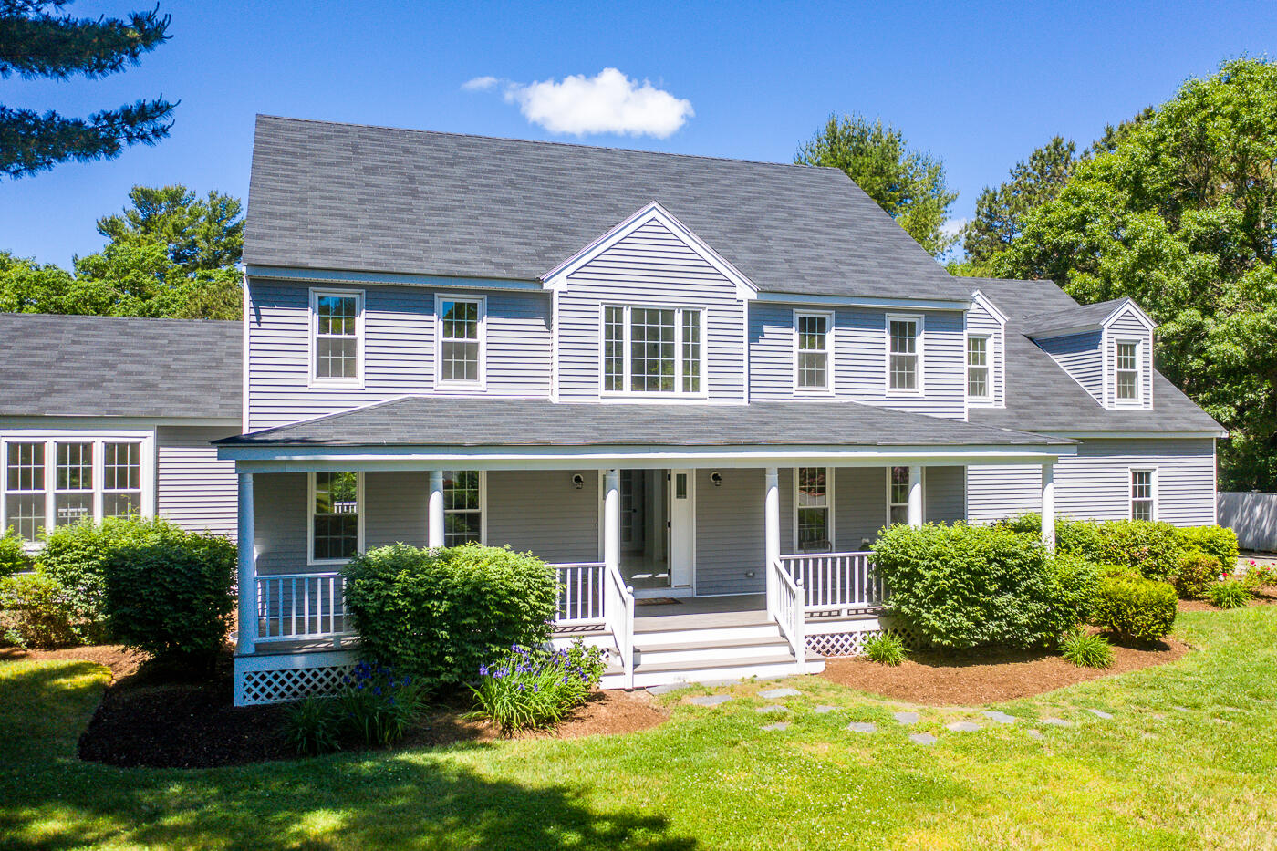 front view of a house with a yard