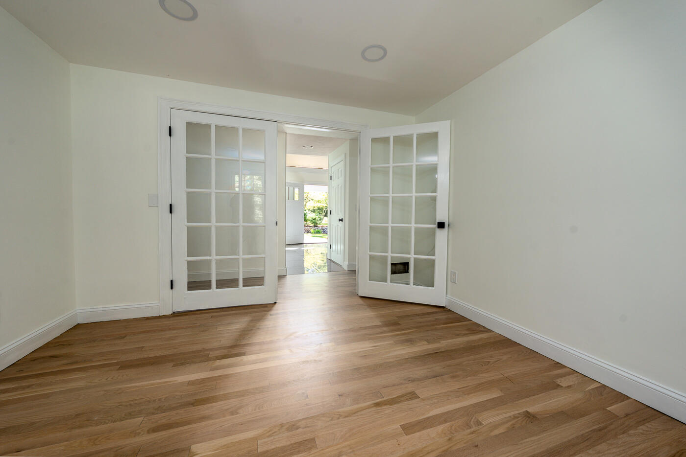 83 Whitmar Road Barnstable, MA 02635 - Photo 13 of 27 an empty room with wooden floor and windows