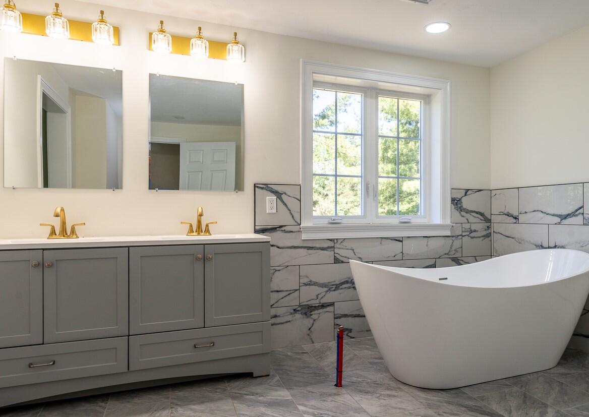 83 Whitmar Road Barnstable, MA 02635 - Photo 15 of 27 a bathroom with a bathtub and 2 sink