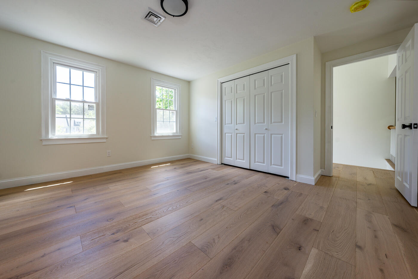 83 Whitmar Road Barnstable, MA 02635 - Photo 18 of 27 an empty room with wooden floor and windows