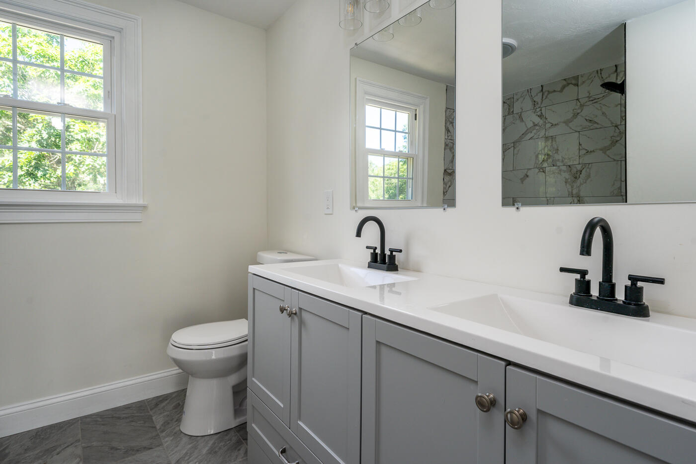 83 Whitmar Road Barnstable, MA 02635 - Photo 19 of 27 a view of a bathroom with a sink and a toilet