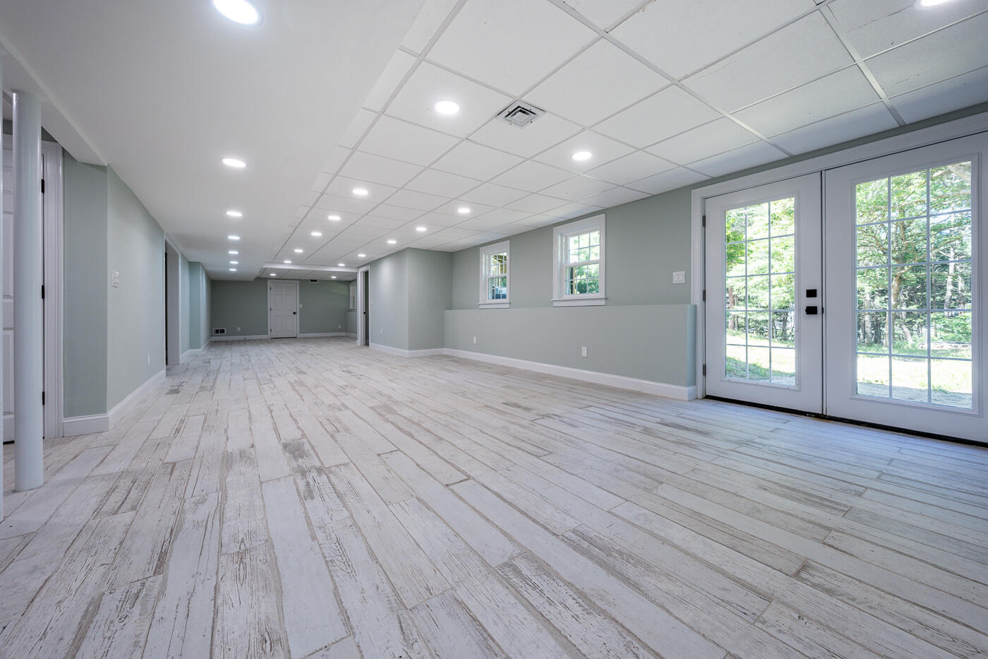 83 Whitmar Road Barnstable, MA 02635 - Photo 20 of 27 a view of an empty room with wooden floor and a window