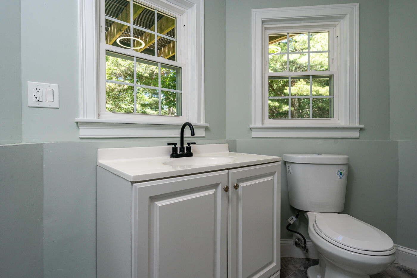 83 Whitmar Road Barnstable, MA 02635 - Photo 22 of 27 a bathroom with a toilet a sink and a window