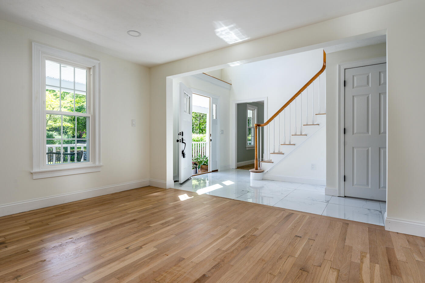 83 Whitmar Road Barnstable, MA 02635 - Photo 7 of 27 an empty room with wooden floor and windows