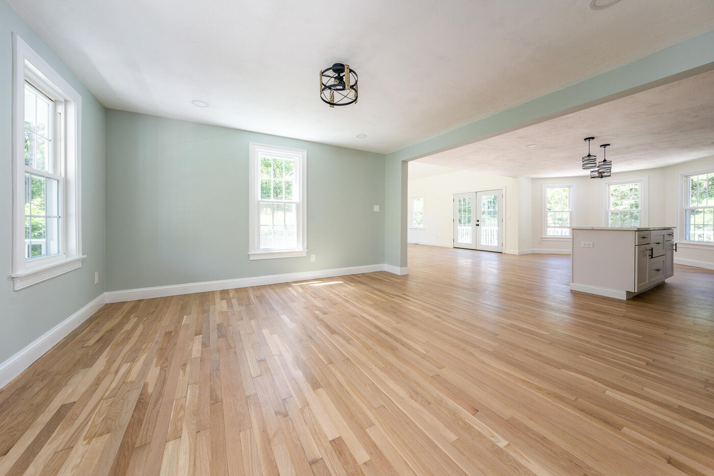 83 Whitmar Road Barnstable, MA 02635 - Photo 8 of 27 an empty room with wooden floor and windows