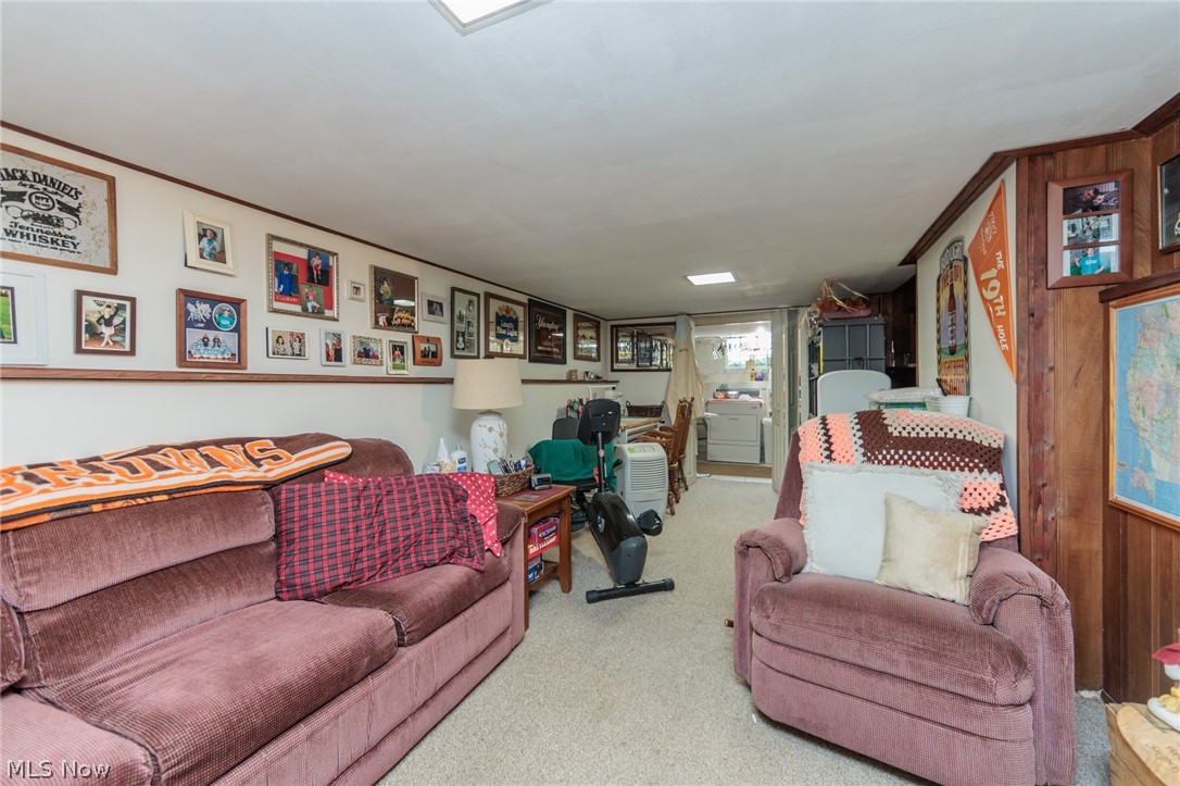 5364 Summit Road Lyndhurst, OH 44124 - Photo 27 of 42 Recreation room featuring carpet flooring, white walls with a chair rail, and wood paneling