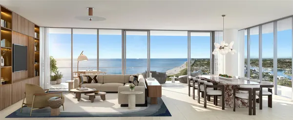 a living room with furniture and large windows