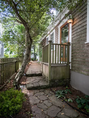 a view of a house with a small yard