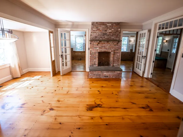 a view of living room with furniture and fireplace