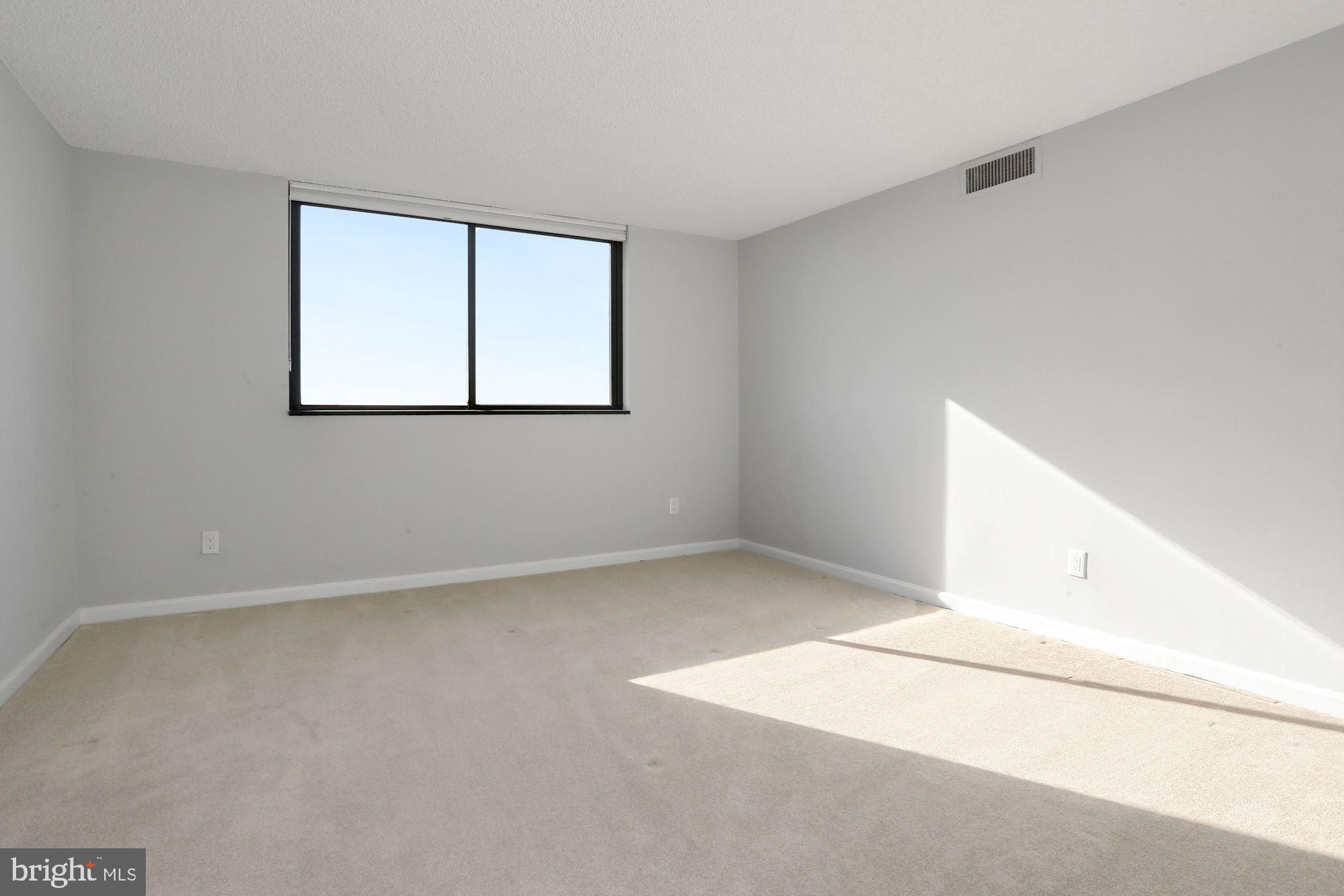 1101 South Arlington Ridge Road, Unit 902 Arlington, VA 22202 - Photo 18 of 38 an empty room with windows
