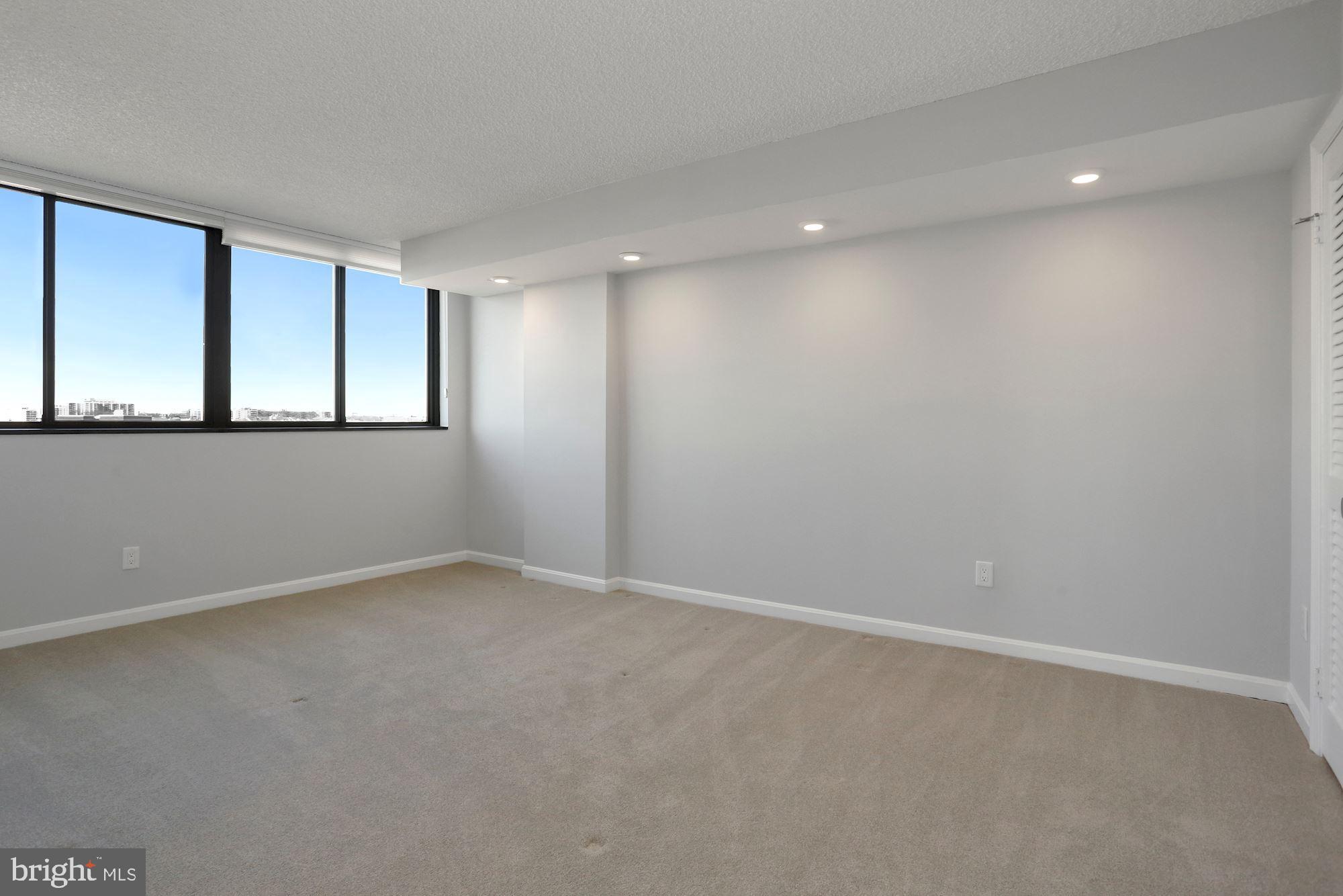 1101 South Arlington Ridge Road, Unit 902 Arlington, VA 22202 - Photo 25 of 38 a view of an empty room with a window