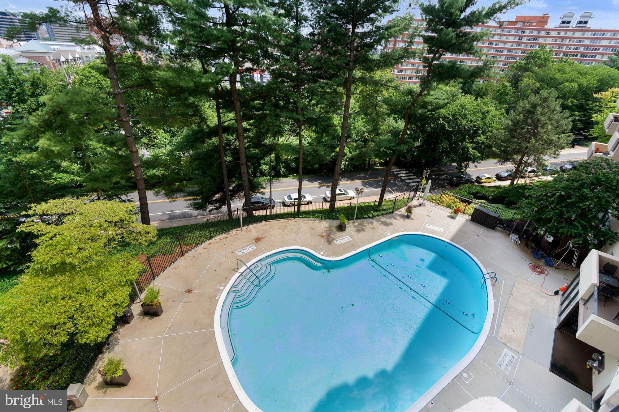 1101 South Arlington Ridge Road, Unit 902 Arlington, VA 22202 - Photo 35 of 38 a view of a swimming pool with lounge chair