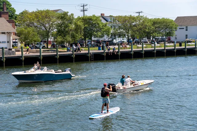 a view of a lake with boats and trees