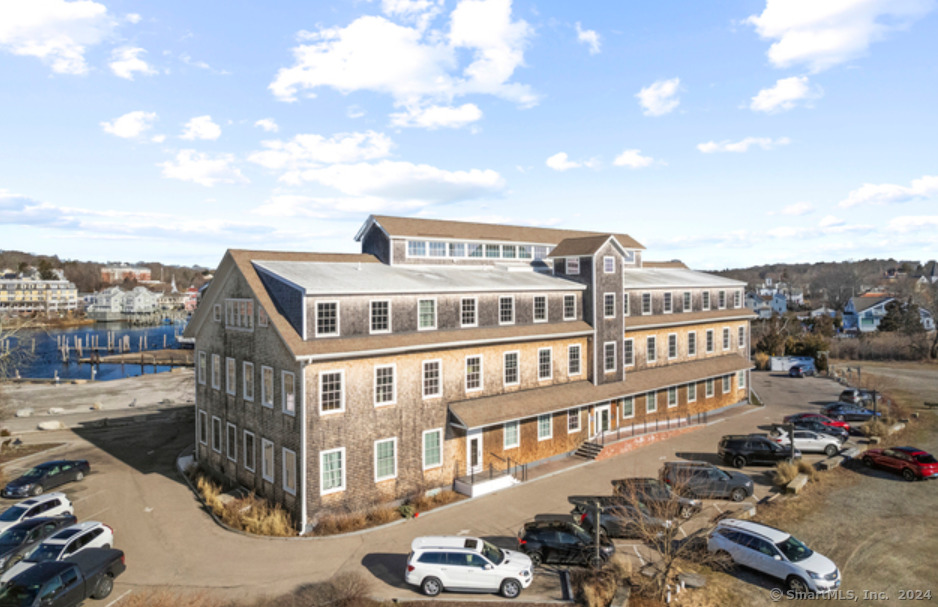 60 Willow Street, Unit 305 Stonington, CT 06355 - Photo 3 of 21 a view of a large building with a city view