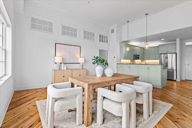 a dining room with furniture and window