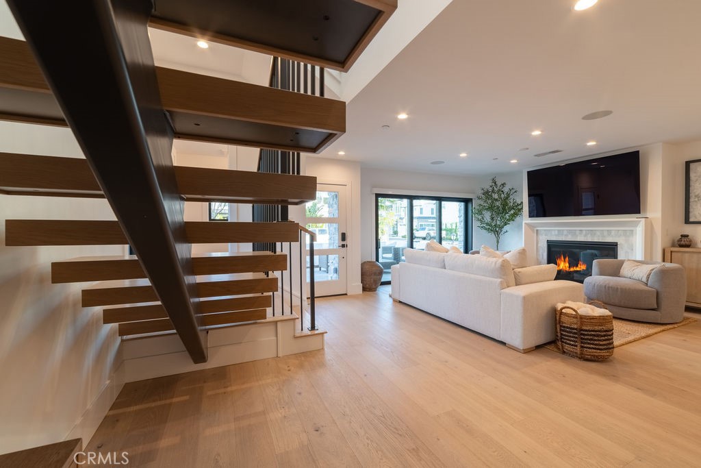 603 Acacia Avenue, Unit A Corona del Mar, CA 92625 - Photo 19 of 53 a living room with furniture and a fireplace