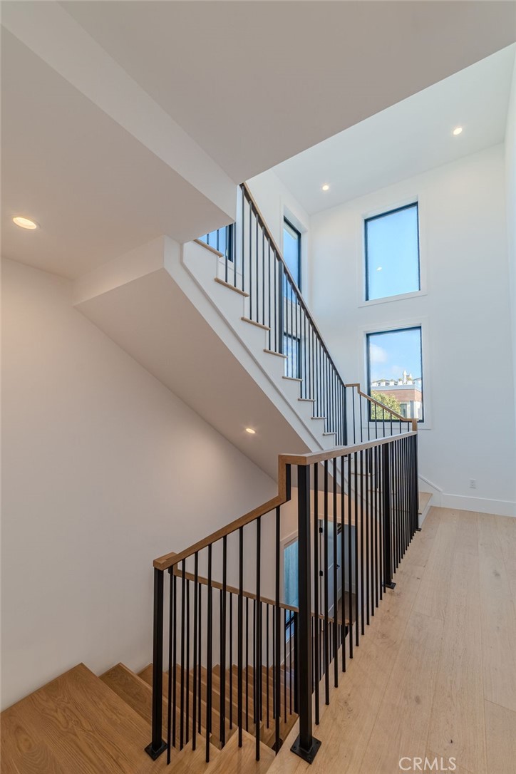 603 Acacia Avenue, Unit A Corona del Mar, CA 92625 - Photo 30 of 53 a view of staircase with railing and white walls