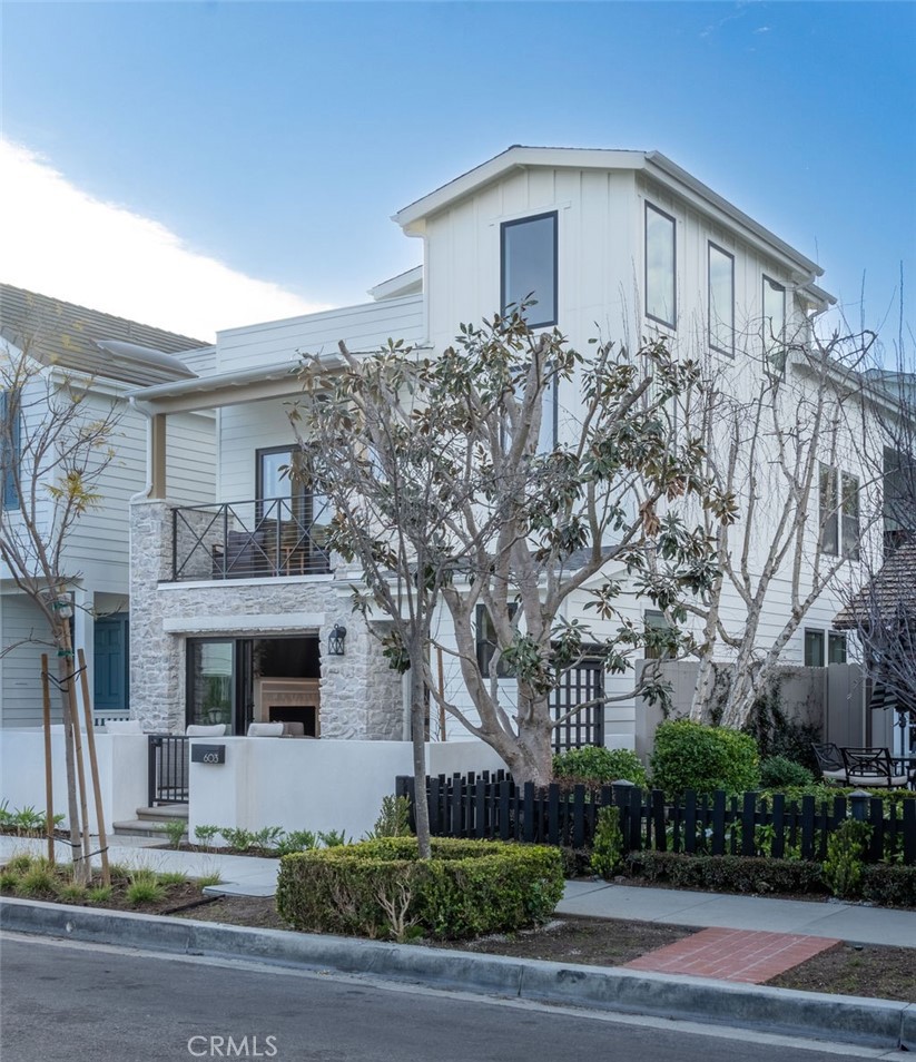 603 Acacia Avenue, Unit A Corona del Mar, CA 92625 - Photo 3 of 53 a front view of a house with garage and yard
