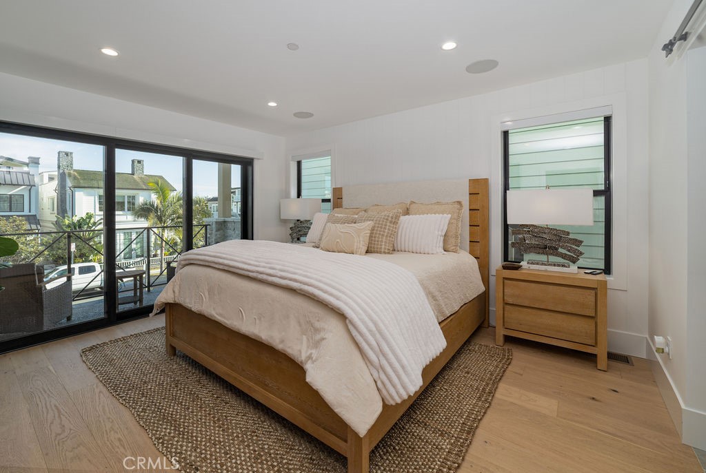 603 Acacia Avenue, Unit A Corona del Mar, CA 92625 - Photo 32 of 53 a bed room with a bed and a large window