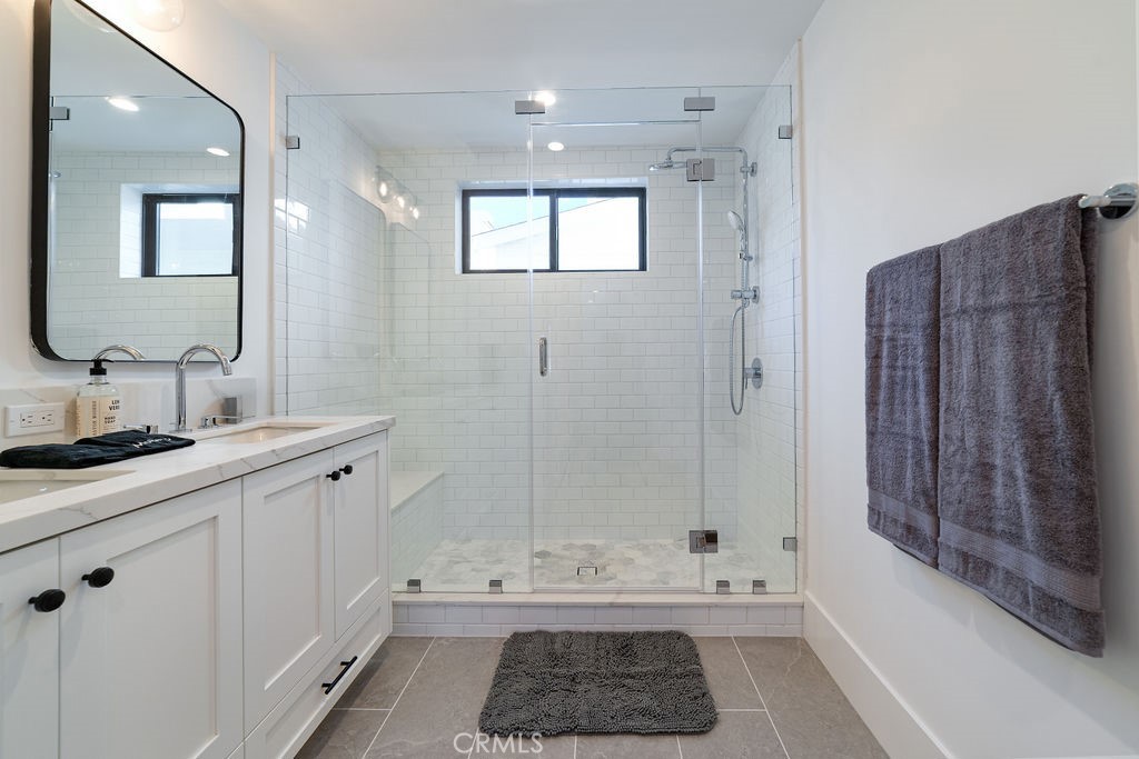 603 Acacia Avenue, Unit A Corona del Mar, CA 92625 - Photo 36 of 53 a bathroom with a sink a toilet and shower