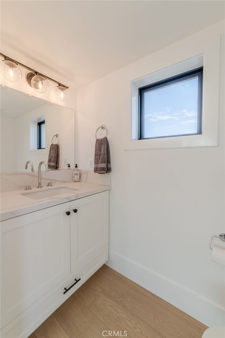 603 Acacia Avenue, Unit A Corona del Mar, CA 92625 - Photo 37 of 53 a bathroom with a sink and a mirror