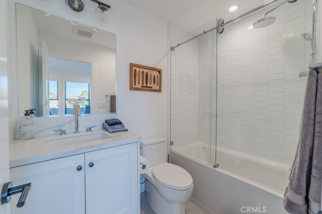 603 Acacia Avenue, Unit A Corona del Mar, CA 92625 - Photo 42 of 53 a bathroom with a sink toilet and shower