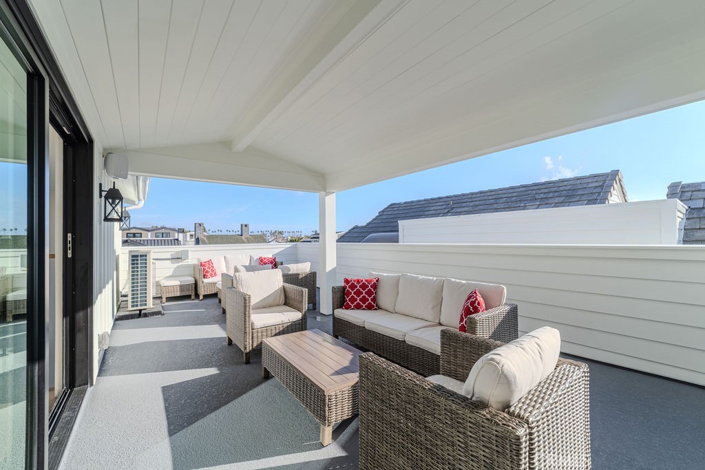 603 Acacia Avenue, Unit A Corona del Mar, CA 92625 - Photo 47 of 53 a living room with furniture and a couch