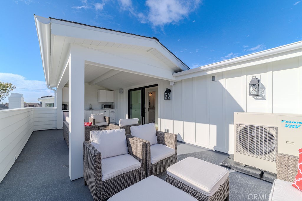 603 Acacia Avenue, Unit A Corona del Mar, CA 92625 - Photo 48 of 53 a living room with furniture and a window