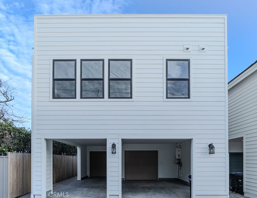 603 Acacia Avenue, Unit A Corona del Mar, CA 92625 - Photo 53 of 53 a front view of a house with garage