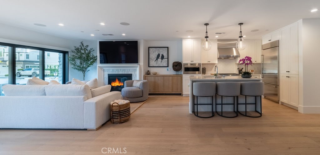 603 Acacia Avenue, Unit A Corona del Mar, CA 92625 - Photo 9 of 53 a living room with furniture and a fireplace