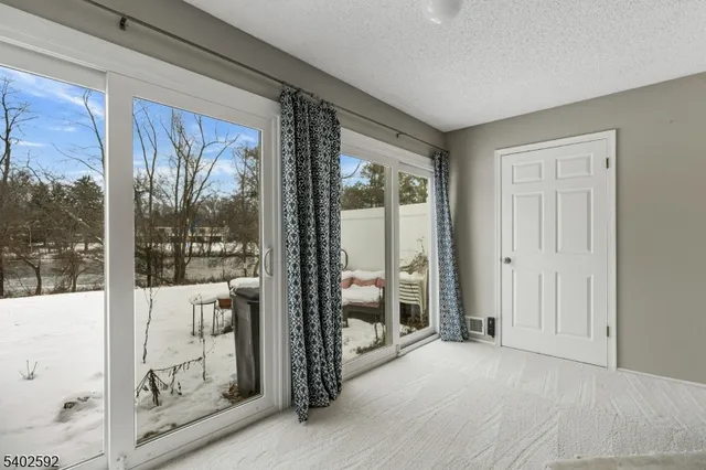 a view of a room with a large window