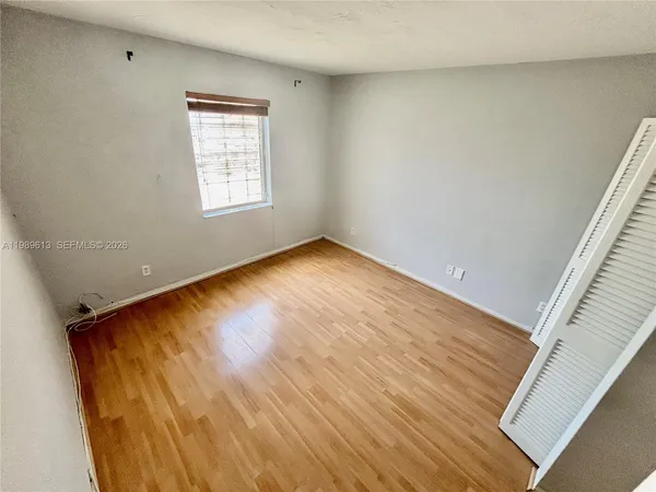 a bedroom with a bed and a table in it