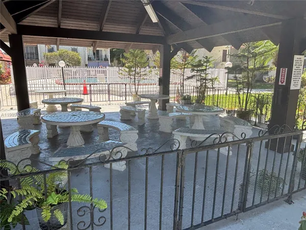 a bathroom with a tub and a double vanity sink