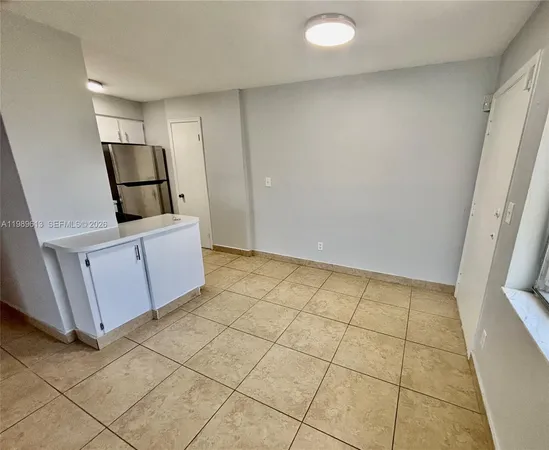 a kitchen with stainless steel appliances a refrigerator sink and microwave