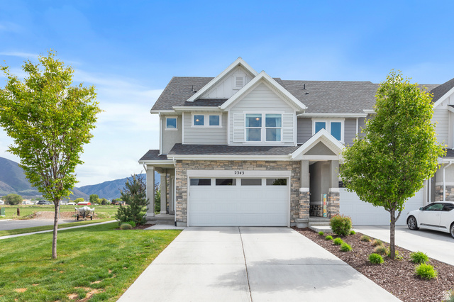 2343 Wysteria Drive Mapleton, UT 84664 - Photo 5 of 30 Craftsman-style home with a mountain view, concrete driveway, a shingled roof, and stone siding