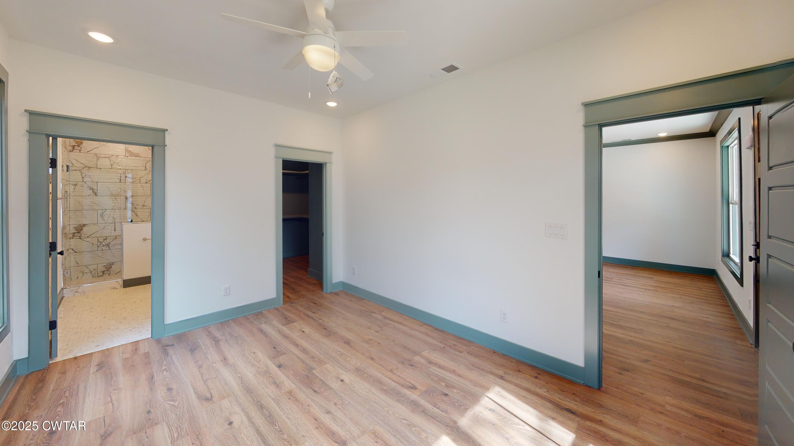 205 McCowat Street Jackson, TN 38301 - Photo 11 of 23 wooden floor in an empty room with a window