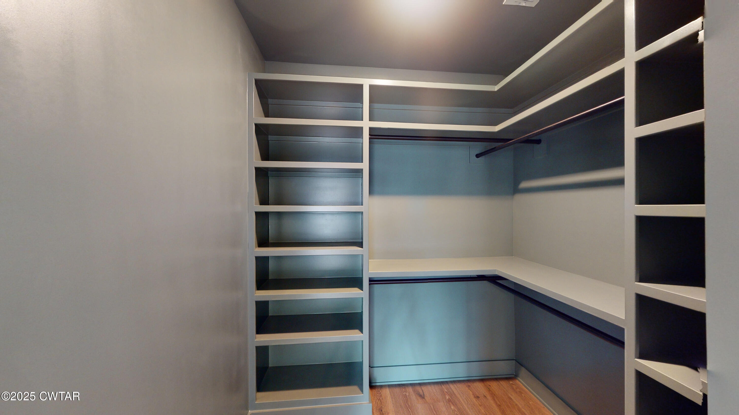 205 McCowat Street Jackson, TN 38301 - Photo 12 of 23 a view of walk in closet with empty racks