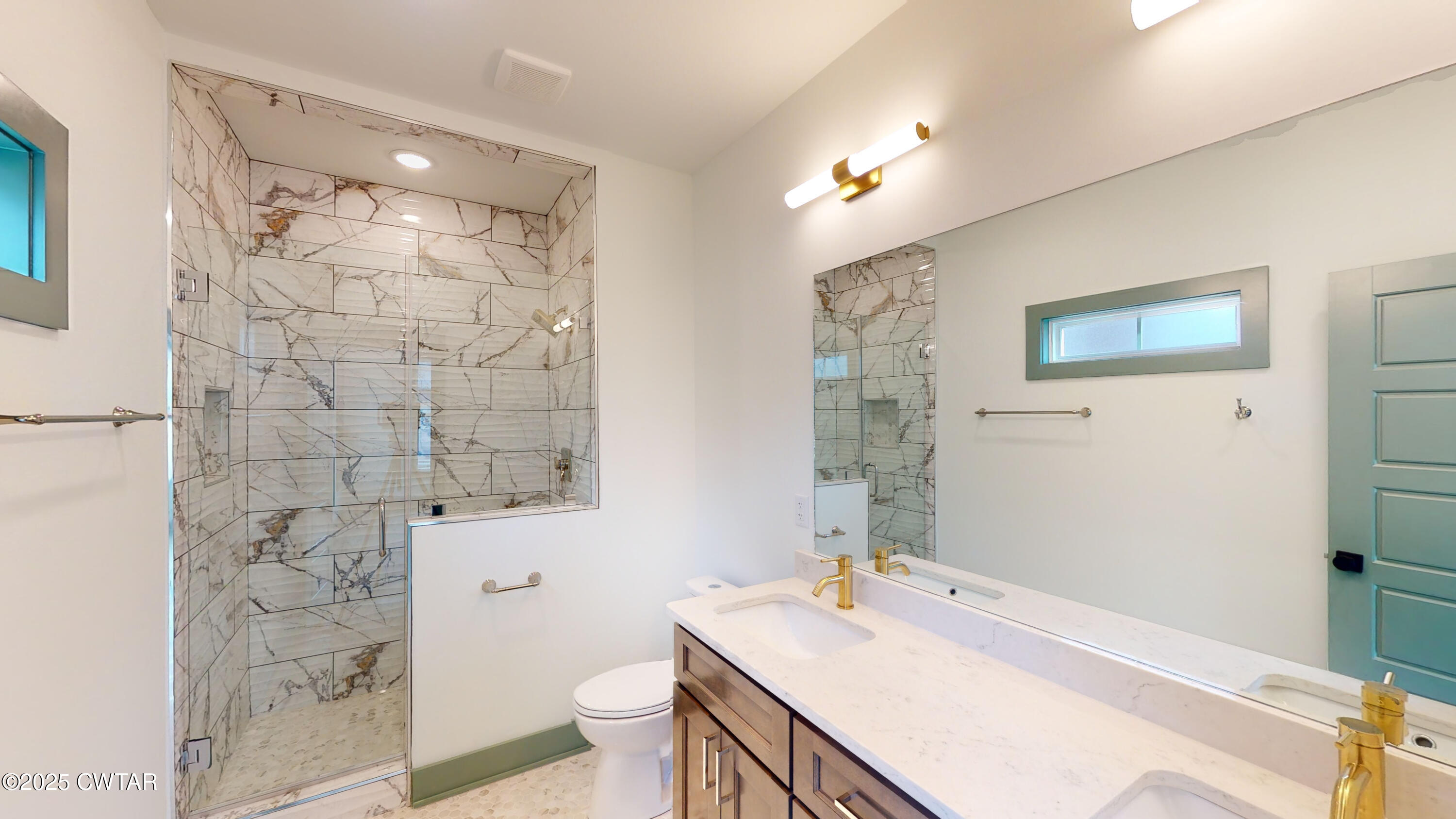 205 McCowat Street Jackson, TN 38301 - Photo 13 of 23 a bathroom with a sink and a mirror