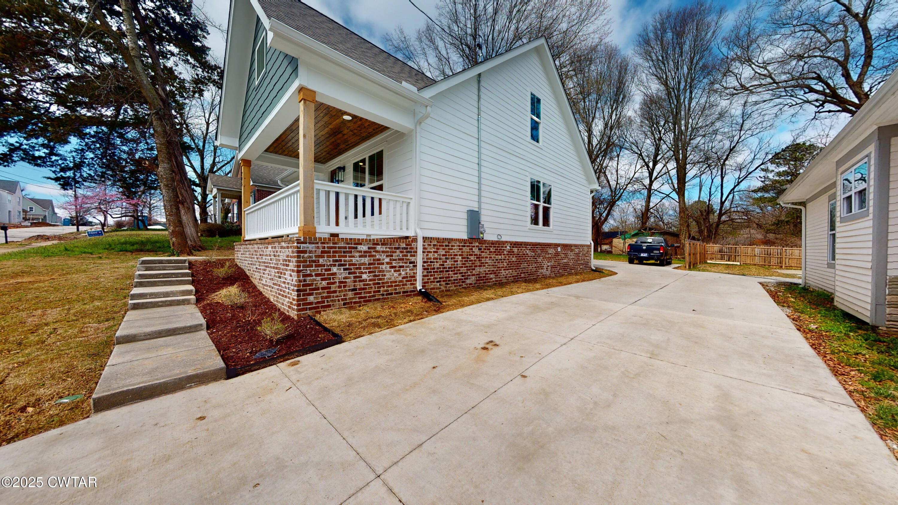 205 McCowat Street Jackson, TN 38301 - Photo 20 of 23 a front view of a house with a yard