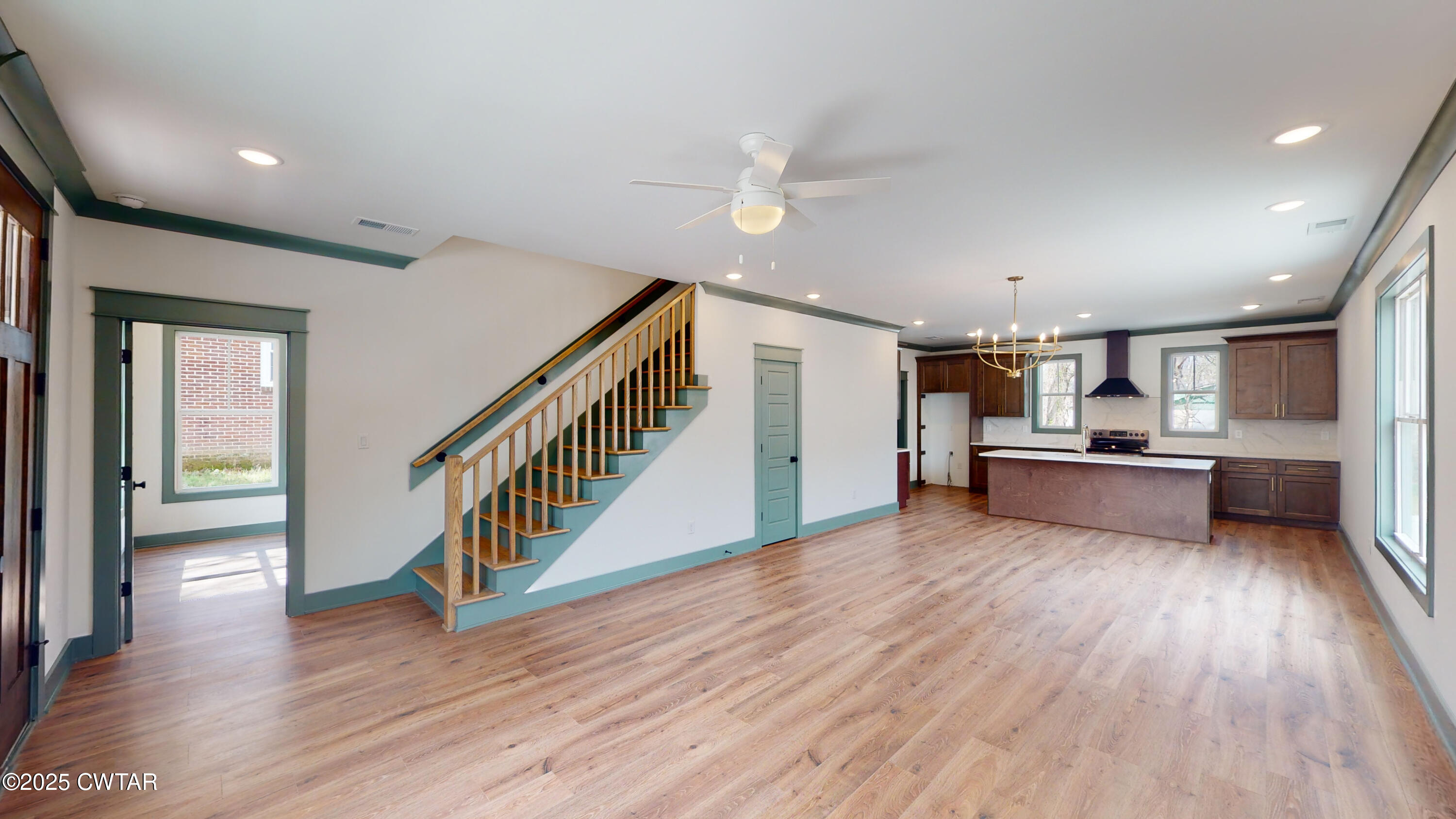 205 McCowat Street Jackson, TN 38301 - Photo 2 of 23 a living room with furniture and a wooden floor