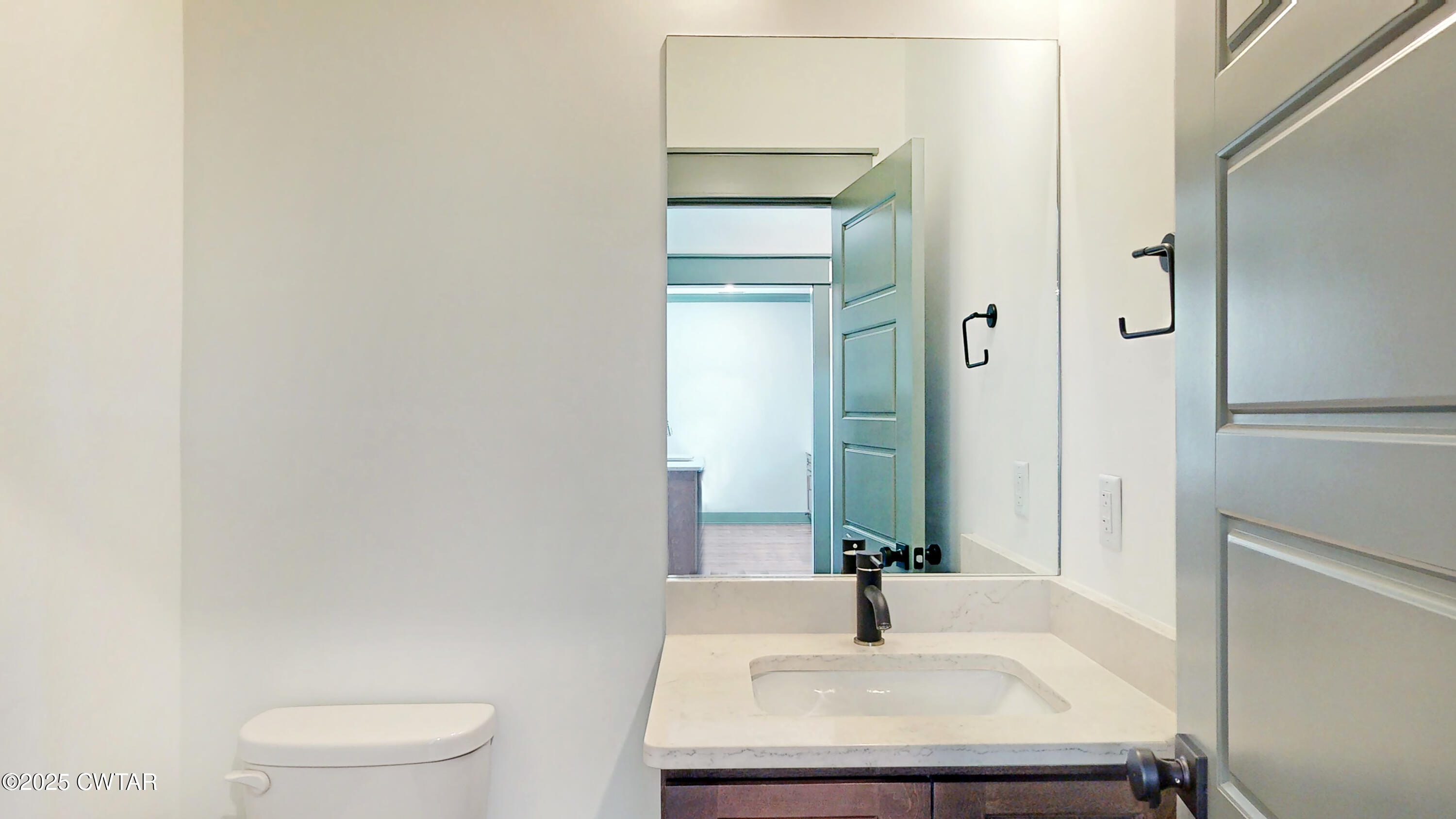 205 McCowat Street Jackson, TN 38301 - Photo 9 of 23 a bathroom with a sink a toilet and shower