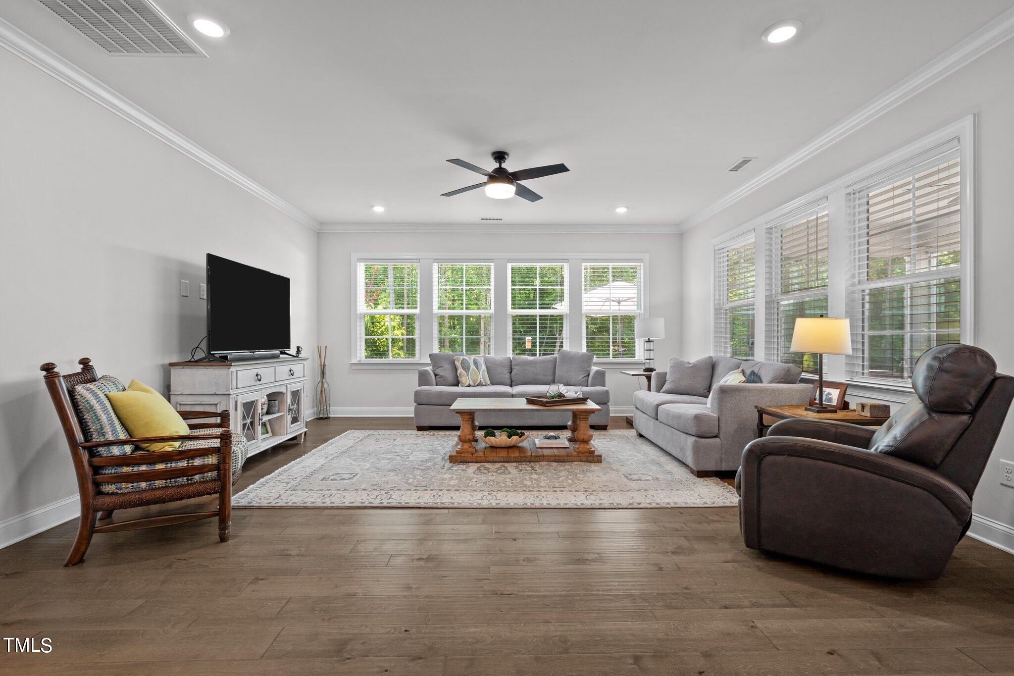 229 Ivory Lane Raleigh, NC 27610 - Photo 15 of 46 a living room with furniture and a flat screen tv