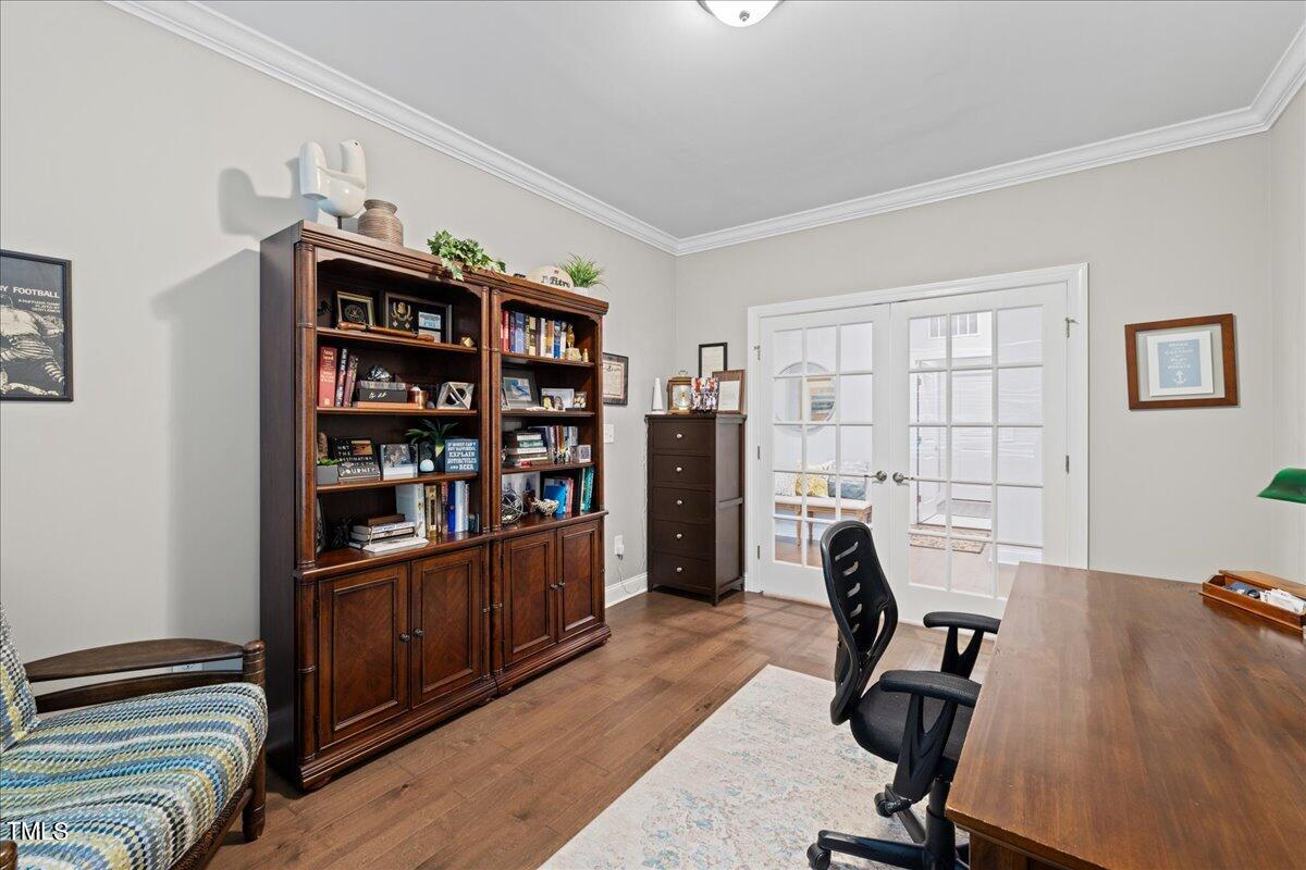 229 Ivory Lane Raleigh, NC 27610 - Photo 7 of 46 a view of a workspace with furniture and a window