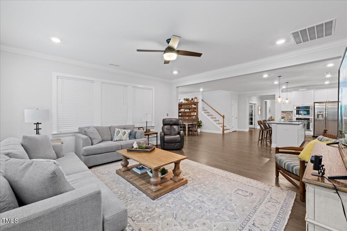 229 Ivory Lane Raleigh, NC 27610 - Photo 10 of 46 a living room with furniture and kitchen view