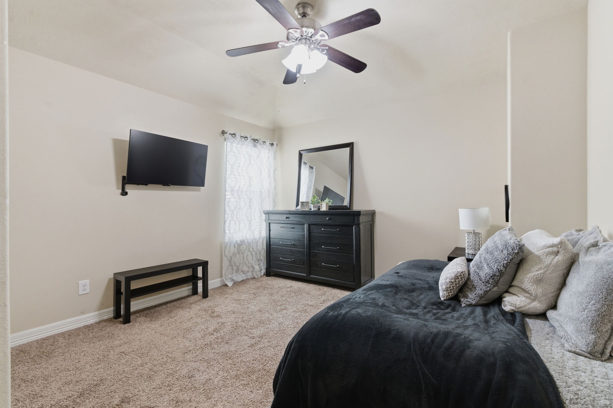 1737 Round Oak Lane Conroe, TX 77304 - Photo 22 of 39 a bedroom with a bed and a flat screen tv