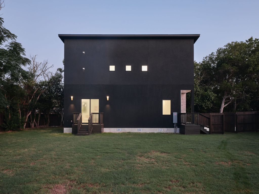 Back of property featuring crawl space and stucco siding
