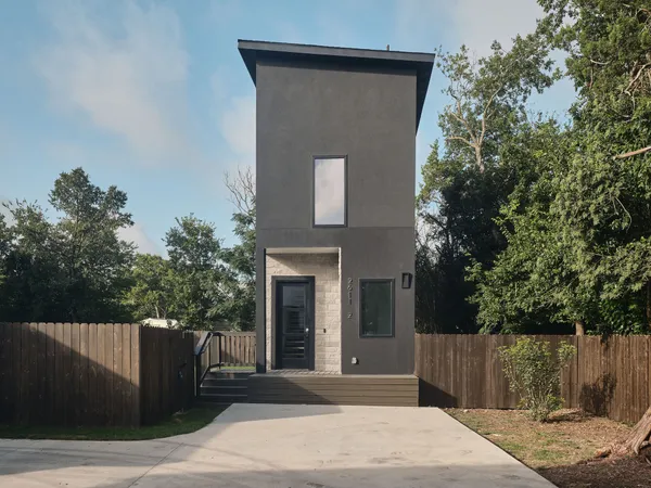 a house with a tree in front of it