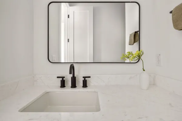 a bathroom with a bathtub and a sink